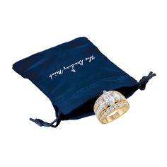 two wedding rings sitting on top of a blue bag