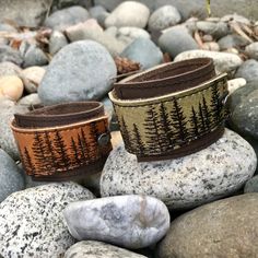 "I've made this wrapping cuff out of soft, smooth olive taupe and choose from brown or black base leather. The leather has been hand printed with an image using indelible (permanent) ink. Machine stitched, it has an attached elastic that hooks over a button, so this cuff will adjust to fit most wrist sizes 5.75\" to 7\" in circumference. At the narrowest, the width of the cuff is 1.25\" and at the widest it's 2\". Only premium quality leather and supplies are used to handcraft each item. Small i Cuff Bracelets Diy, Shiney Things, Leather Gifts For Her, Diy Leather Bracelet, Diy Slippers, Leather Jewellery, Leather Cuff Bracelet, Leather Wristbands, Hand Painted Jewelry