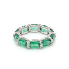 Emerald oval east west eternity band ring gold | Natural oval emerald pave diamond eternity band gold | Real emerald cut emerald ring gold GEMSTONE DETAILS: ✦ Gemstone : Emerald ✦ Gemstone Type : Natural ✦ Gemstone Size : 6x3 MM ✦ Gemstone Shape : Ova ✦ Number of Gemstones : 14 ✦ Gemstone Weight : 6-7 Carats ✦ Gemstone Grade : AAA DIAMOND DETAILS : ✦ Diamond Type : Natural ✦ Diamond Size : 1.00 mm ✦ Diamond Color : F-G ✦ Diamond Clarity : Slightly included ✦ Diamond Cut : Excellent - Very Good ✦ Oval Emerald Ring With Single Cut Diamonds, Emerald Cut Emerald Ring, Emerald Birthstone Ring, Emerald Statement Ring, Emerald Eternity Band, Eternity Ring Gold, Green Emerald Ring, Emerald Ring Gold, Rainbow Sapphires