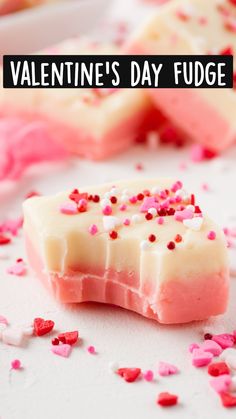 some pink and white candy with sprinkles on it