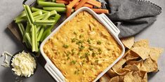 a casserole dish with carrots, celery and green beans