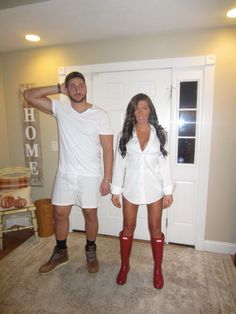 a man and woman dressed in white standing next to each other with red rubber boots