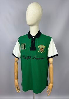 Vintage Polo Ralph Lauren Snow Polo Challenge Polo Shirt Size XL Custom Fit 90s Excellent used condition, without any rips/stains/ etc. PLEASE CHECK MEASUREMENTS!! pit2 pit: 23'6" inches \ 60 cm length on the back: 30'7" inches \ 78 cm shoulders: 19'2" inches \ 49 cm If u have any questions please contact me before purchase Vintage Green Collared T-shirt, Green Collared T-shirt For Streetwear, Casual Green Polo Shirt For Streetwear, Green Short Sleeve Polo Shirt For Streetwear, Green Polo Shirt With Graphic Print, Green Graphic Print Polo Collar Top, Green Polo Collar Top For Streetwear, Green Polo Collar Shirt With Graphic Print, Green Polo Collar Top With Graphic Print