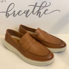 Cole Haan Men's British Tan Grandpro Topspin Penny Loafers Size 12. Never Worn Without Box. Condition Is As Shown In Pictures. Modern Brown Low-top Loafers, Brown Modern Low-top Loafers, Casual Wingtip Loafers With Contrast Sole, Classic Low-top Loafers With White Sole, Low-top Moccasins With Leather Sole For Business Casual, Casual Slip-ons With Brogue Detailing And Moc Toe, Business Casual Low-top Moccasins With Leather Sole, Low-top Loafers With Rubber Sole For Business Casual, Business Casual Low-top Loafers With Rubber Sole