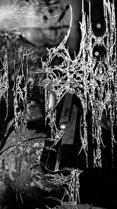 a black and white photo with icicles hanging from the ceiling