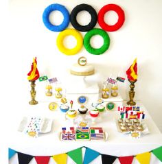 a table topped with lots of different types of items on top of a white surface