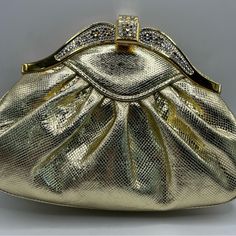 The Original Price In 1996 Was $185. Sold At The Bon-Ton, The Original Tag And Receipt Were Inside. I Believe It Is Leather. Lovely Crystal Work In Great Condition. Can Be Worn As Clutch Or Shoulder Bag (23” Drop). See Photos For Details And Measurements. Comes From Smoke Free Home. High-end Evening Bag, High-end Formal Evening Bag, High-end Gold Party Bag, High-end Gold Party Bags, Luxury Gold Clutch For Formal Occasions, Designer Gold Evening Bag For Formal Occasions, Gold Evening Bag With Gold-tone Hardware For Gala, Classic Gold Clutch For Events, Classic Gold Evening Bag For Formal Occasions