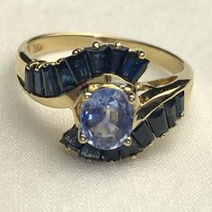 Excellent Vintage Condition. Stunning Oval Cut Tanzanite And Sapphire Gold Ring. 3 Grams Tanzanite Approx. 6x5 Mm Sapphire Approx. 2 Mm Size 7 Sapphire Gold Ring, 7 Rings, Ring Color, Wonderful Things, Womens Jewelry Rings, Oval Cut, Blue Gold, Gold Ring, Sapphire Ring