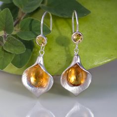 A pair of stunning Silver Plated Brush Textured Calla Bead and Citrine drops earring. The earring hooks are Sterling Silver with beautiful bezel set Citrine beads. Because I use natural stones, the stones may vary slightly in shape, shade and size. Earrings will be shipped wrapped in a Silver Citrine Drop Earrings Jewelry, Silver Citrine Drop Earrings, Handmade Silver Citrine Earrings, Teardrop Citrine Earrings For Anniversary, Elegant Silver Citrine Earrings, Handmade Citrine Teardrop Earrings, Citrine Teardrop Earrings For Gift, Handmade Teardrop Citrine Earrings, Citrine Teardrop Jewelry With Matching Earrings