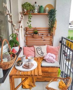 the balcony is decorated with plants and potted plants