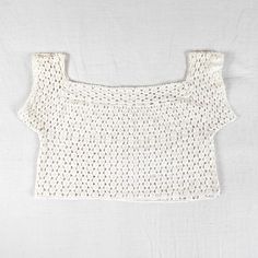 Really beautiful handmade, one of a kind, fine crochet lace crop top. 100% cotton. Straight or square neckline, the sleeves sit slightly off the shoulder. It might fit more like a bra depending on your bust size. Excellent condition- barely noticeable discoloration in some areas. Its difficult to date this piece but I would guess 1960's or earlier. I consider this an item that would be nice to work into a bridal outfit, as it has a delicate romantic vibe. Please don't hesitate to ask if you have Bohemian White Square Neck Tops, Cropped Lace Crochet Top, Cropped Crochet Lace Top, Cotton Lace Crop Top, White Crochet Lace Crop Top, Cropped Cotton Crop Top With Crochet Lace, White Cropped Crop Top With Crochet Lace, Fitted Cotton Crochet Lace Crop Top, Handmade Cotton Crochet Crop Top