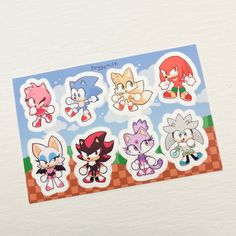 the stickers are all different colors and sizes, including sonic cat tails on them