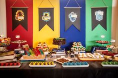 a table topped with lots of food and desserts