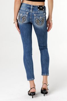 Low-rise, medium dark-wash skinny jeans- Embroidered wings with black leather and mini rhinestone details- Rhinestone rivets- Embossed black leather logo brand patch- 5-pocket design- Slight fading Model is wearing size: 26Model Measurements:Height: 5'8"Bust: 35"Waist: 26"Hips: 39" Fabric Content: 52% Cotton, 27% Lyocell, 20% Polyester, 1% Elastane Care: Gentle machine wash inside-out with like colors in cold water, Tumble dry low. Style No. L9340S-K1452 Shadow Wings, Jeans Embroidered, Straight Clothes, Leather Logo, Jean Outfits, Pocket Design, Get The Look, Bootcut Jeans, Short Tops