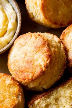 some biscuits and butter are on a table