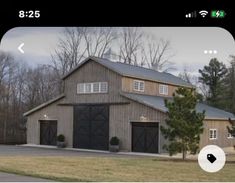 a house with two garages in front of it