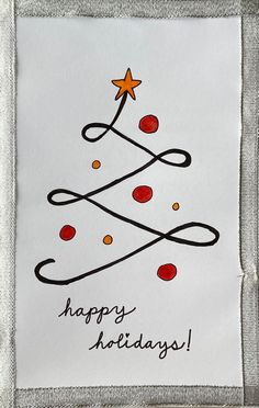 a card with a christmas tree drawn on it