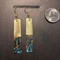 These Upcycled, reclaimed brass patina verdigris earrings are made from sanitized recycled brass. They are upcycled by various processes including first a meticulously cut, sanding, drilling, shaped, rough polished and then patinaed with our specialized process that specifically allows similar but not exacting patterns on each earring pair; followed by an acrylic overcoating. Then they are mounted with all new hypoallergenic ear wires. Each set is exquisitely unique.  We handcraft from reclaimed cleaned and sanitized materials. Many of our raw materials are derived from roofing, electrical, plumbing and building contractors we associate with.  THANK YOU, CONTRACTORS, for allowing us to rummage through your scrap heaps of metals Artistic Copper Earrings With Patina, Gold Bohemian Earrings With Patina, Bohemian Gold Earrings With Patina, Artistic Metal Jewelry With Patina, Vintage Copper Earrings With Patina, Unique Patina Copper Earrings, Copper Dangle Jewelry With Patina, Copper Dangle Earrings With Patina, Unique Copper Earrings With Patina