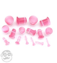 Pretty pink cat's eye glass plugs! Single flare shaped. Sizes / gauges range from 8g, 6g, 4g, 2g, 0g, 00g, 7/16", and 1/2". Sold in pairs starting at $12/pair. Orders over $20 ship free Gauge Jewelry, Angel Bites, Pretty Plugs, Pastel Skull, Tapers And Plugs, Cool Piercings, Body Modification, Nail Tattoo, Body Jewelry Piercing