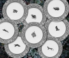 six plates with different animal designs on them