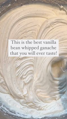 a bowl filled with whipped cream next to a sign that reads, this is the best vanilla bean whipped ganache that you will ever taste