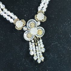 This is part of Chairish’s Costume Jewelry assortment.  1900s Edwardian sterling & crystal necklace. Centerpiece w/ sterling frame supporting faceted crystal discs w/ floral centers, graduated crystal dangles, filigree platforms w/ carved glass rosettes; double strands of graduated crystals w/ sterling separators finished w/ filigree clasp w/ carved crystal rose. Spectacular creation in stunningly excellent condition, it glitters and glistens and gleams. The height of antique elegance and grace, Vintage Filigree Jewelry For Celebration, Victorian Beaded Jewelry For Vintage Events, Vintage White Crystal Jewelry, Vintage Crystal Pendant Jewelry, Vintage Adjustable Jewelry For Celebrations, Elegant Vintage Collection Jewelry, Vintage Clear Necklace For Wedding, Vintage Clear Necklaces For Formal Occasions, Victorian White Jewelry Vintage Collection