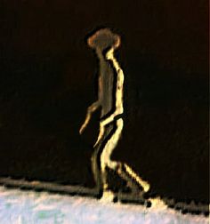 a blurry image of a man walking in the snow with his feet up and one hand on his hip