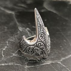 Silver Men's Archer Thumb Handmade Ring , Silver Hand Engraved Archer Men's Ring , Silver Embroidered Archer Carved Ring , Gift For Him , Same Day For Shipping ✧ Product Details * Handmade İtem * Gender : Male / Female * Material : 925K Sterling Silver * Ring Weight : 11 Grams ✔ Usage Details * Silver jewelry is very sensitive to chemicals. It is recommended to keep away from chemical substances such as cream, bleach, deodorant, detergent. * Silver jewelry can also darken quickly in salt water, that is, in sea water. For this reason, it is best to remove them when swimming in the sea. ✔ Shipping * Your orders placed on weekdays are delivered to the cargo on the same day. Your orders placed on the weekend are delivered to the cargo on Monday. ✔ Other Details * Our products are handmade and Thumb Rings Men, Chemical Substances, Carved Ring, Thumb Rings, Men's Ring, Ring Collections, Silver Man, Hand Engraving, Ring Silver