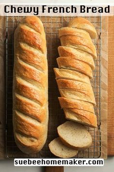 two loaves of bread sitting on top of a cooling rack next to each other