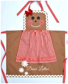 a brown bag with a red and white striped dress on it's side, featuring a gingerbread man