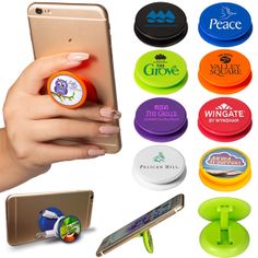 a person holding a cell phone and various magnets