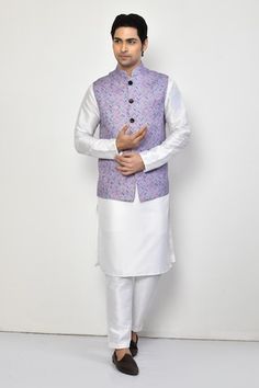 Purple sleeveless bundi with all over herringbone pattern. Paired with a white full sleeves plain kurta and a pant. - Aza Fashions White Sleeveless Nehru Jacket For Festive Occasions, White Sleeveless Cotton Nehru Jacket, Sleeveless White Nehru Jacket For Festive Occasions, Festive White Sleeveless Nehru Jacket, Sleeveless White Kurta For Spring, White Cotton Nehru Jacket With Stand Collar, White Sleeveless Nehru Jacket For Spring, White Nehru Jacket For Festive Winter Occasions, Traditional Fitted White Vest