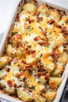 a casserole dish with potatoes, bacon and cheese