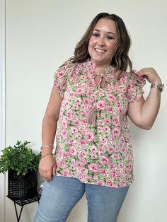 Product Description: Introducing the Bella Floral Blouse featuring a self-tie tassel neck and the beautiful colors of spring, pink and green. Lightweight for optimal comfort as the weather warms up and pairs perfectly with any bottoms you choose. We love this blouse because it is easily dressed down with denim or up with dress pants, a skirt and would look amazing paired with white!! Elevate your wardrobe with this beautiful piece, we know you won't regret it! Quick Product Details and Features: Spring Beach Tie Neck Tops, Spring Tie Neck Top For Beach, Spring Beach Blouse With Tie Neck, Spring Tie Neck Blouse For The Beach, Tie Neck Blouse For Beach And Spring, Casual Tie Neck Top For Vacation, Spring V-neck Blouse With Tassel Ties, Green Tie Neck Top For Summer, Casual Multicolor Tie Neck Tops