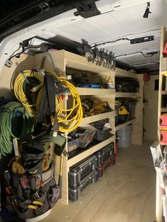 the inside of a vehicle with various tools and equipment in it, including hoses