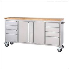 a large metal cabinet with drawers and wooden top on casteors to the side, in front of a white background