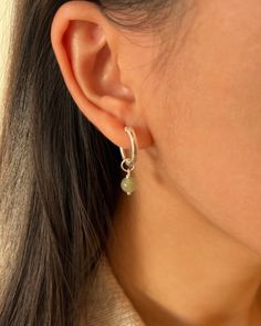 "This pair of mossy-green dangle earrings will be your go-to piece. Shinny 6-7mm round nephrite, a variation of jade known for its exceptionally deep green hue, matches with minimal S925 Sterling Silver hoop earrings.    ✿ Sold in a pair ✿ Material: 6-7mm /0.24-0.28in Natural Round Nephrite  ✿ Finish: 15mm S925 Sterling Silver Huggie Hoops ✿ Approx. 1 inch in length and 0.6 inches in width ✿ Tarnish resistant, hypoallergenic, safe for sensitive skin     ✿ P L E A S E   N O T E:     All of our fr Green Small Hoop Sterling Silver Jewelry, Green Sterling Silver Small Hoop Jewelry, Green Sterling Silver Small Hoop Earrings, Green Sterling Silver Single Earring, Minimalist Silver Earrings For May Birthstone, Green Sterling Silver Huggie Earrings, Everyday Green Sterling Silver Earrings, Green Sterling Silver Hoop Earrings For May Birthstone, Silver Single Earring For May Birthstone