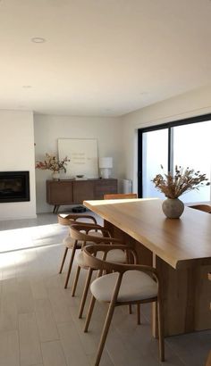 a dining room table with chairs around it