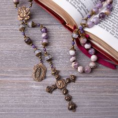 SAVE TODAY WHEN YOU SIGN UP FOR OUR NEWSLETTER Receive updates on upcoming sales, discounts and new products by signing up for newsletter using this link: http://bit.ly/TeamBelieversSave ♦DESCRIPTION♦ Beautiful heirloom quality and vintage-looking rosary is perfect gift for a women or girl celebrating one of the sacraments or special day. This rosary is made of delicate 8mm cape amethyst beads and moonstone gemstone beads with bronze metal findings. This rosary has a heavy weight with beautiful Bohemian Rosary With Natural Stones For Gifts, Purple Rosary, Rosa Mystica, Red Lightning, Catholic Necklace, Catholic Rosary, Rosary Catholic, Vintage Rainbow, Bronze Metal