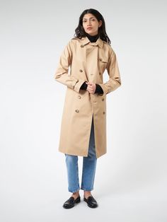 A timeless style that will never go out of style, this A.P.C. trench coat is made from waterproof Italian cotton gabardine. Finished with all the classic details. Spread collar Hang loop inside neckline Removable buttoned tab can be positioned below neck Buttoned epaulettes Double-breasted Raglan sleeves Belted, buckled cuffs Fitted at waist with removable belt Raglan pockets with wide piping Back rain shield Fitted silhouette Long, flared cut Materials Fabric Content: 100% cottonLining: 100% viscose Size Guide Jiya wears size XS.She is 5'9"; bust 31"; waist 24"; hips 35" Size 36 Size 38 Chest 47 50 Length 106 106 Fits true to size. We recommend taking your normal size. For additional size information, please visit our size guide or contact Customer Service at mailorder@gravitypope.com Fitted Silhouette, Go Out, Out Of Style, Timeless Style, Raglan Sleeve, A P, Double Breasted, Size Guide, Timeless Fashion