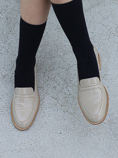 Editor's NotesMOL:pin presents sophisticated footwear that gives off a stylish mood.- Smooth and glossy surface- Great to match with any socks- Soft and durable cow leather used- Comfortable to wearMeasurements(in.)- Size: KR 225MM - KR 255MM (US 5.5 - 8.5)- Heel Height: 0.79 in.Composition & Care- Upper: Cow Leather, Lining: Pig Skin- Natural leather may have fine scratches and wrinkles- Bright leather can get stained by denim or dark outfits- Pen and bond marks may occur during the manufac Cream Leather Sole Loafers For Business, Cream Loafers With Leather Sole For Business, Beige Leather Shoes With Leather Sole For Fall, Classic Cream Loafers For Business, Classic Cream Business Loafers, Beige Leather Shoes For Formal Occasions In Fall, Beige Leather Shoes For Formal Fall Events, Formal Beige Leather Shoes For Fall, Modern Beige Loafers With Leather Sole