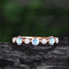 "This is a moonstone and opal engagement ring in solid gold, The stones are round 3mm moonstones and 2mm lab opals (moissanites). The band width is about 1.3mm. It can be made in any ring size. However please contact me to custom make it to a special big or small size. It can be made in white gold,rose gold or yellow gold with 14k or 18k. However for some people who are nickel allergic,I can also make it to 925 sterling silver to make you can wear it. The ring is handmade,very high quality! 30 d Engagement Ring Women, White Opal Ring, Unique Engagement Ring, Opal Engagement, Rose Gold White, Engagement Rings Opal, Ring Women, Unique Engagement, Opal Ring