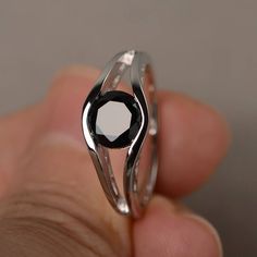 This is a gorgeous handmade creation. Its beauty is its simplicity & Elegance. The 7*7mm round shape faceted natural black spinel is crafted in solid sterling silver and with rhodium plated. All item is sent in a beautiful gift box If you have any idea of design your ring,pls contact me directly. You can realize more lovely stuff clicking the link https://www.etsy.com/shop/knightjewelry?refshopsection_shophome_leftnav Please leave the correct address and you phone number for delivering succe Black Sapphire Fine Jewelry, Black Sapphire Fine Jewelry Ring, Classic Sapphire Ring With Black Spinel For Promise, Classic Black Sapphire Ring In Sterling Silver, Minimalist Silver Black Spinel Jewelry, Minimalist Silver Jewelry With Black Spinel, Elegant Black Sapphire Ring, Minimalist Black Sapphire Ring As Gift, Elegant Sapphire Rings With Faceted Cut