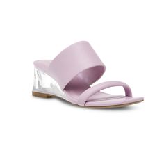 The Gaia Sandal is the perfect summer sandal that can be worn on any occasion. This stylish sandal is made with materials that provides extra comfort and flexibility while wearing. The clear wedge heel adds a modern look to the shoe. Description: - Closure Type: Slip-on- Heel Height: 2"- iFlex Technology- Faux Leather- Colors: Lilac and White Free Shipping Clear Strap Synthetic Sandals, Clear Synthetic Sandals With Clear Strap, Clear Open Heel Jelly Sandals For Summer, Summer Clear Jelly Sandals With Open Heel, Clear Platform Sandals For The Beach, Clear Strap Open Toe Sandals, Summer Clear Heels With Translucent Outsole, Clear Heels With Translucent Outsole For Summer, Modern Sandals With Block Heel For Beach