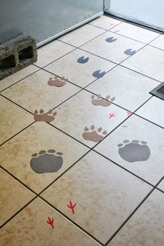 the floor is decorated with footprints and arrows