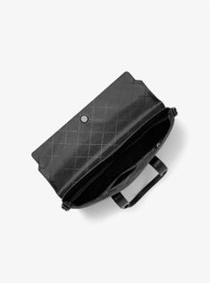 The Cooper briefcase is made from Signature logo-print canvas with contrasting trim, striking the perfect between smart and laid-back. Despite its slim profile, the interior features an array of pockets to keep your essentials organized, and it comes with a detachable shoulder strap for hands-free wear. Use it to carry everything you need for a day at the office. Black Rectangular Briefcase In Coated Canvas, Black Coated Canvas Rectangular Briefcase, Black Rectangular Coated Canvas Briefcase, Coated Canvas Shoulder Briefcase For Business, Rectangular Coated Canvas Briefcase With Top Handle, Black Coated Canvas Briefcase For Business, Office Rectangular Coated Canvas Satchel, Modern Briefcase In Coated Canvas, Business Coated Canvas Shoulder Satchel