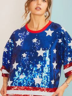 Show patriotism in a stylish way with this fully sequined blue top, adorned with white star details and red and white striped hems. Its impeccable design will make it the perfect choice for holiday celebrations like Memorial Day and the 4th of July. The sparkle of sequins will display just the right amount of patriotism and make you stand out in any event. 100% Polyester. Fit: This top is intended to have a relaxed fit. Bust: The bust is intended to be slightly relaxed and ranges from 32" to 42" Sequin Crop Top, Sequin Shorts, White Star, Sequin Top, Blue Top, Holiday Celebration, Memorial Day, American Girl, 4th Of July