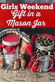 two mason jars filled with red stuff and the words girls weekend gift in a mason jar