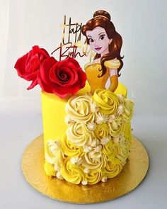 a yellow cake with red roses on top