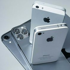 two iphones sitting on top of each other next to an ipod and another cell phone